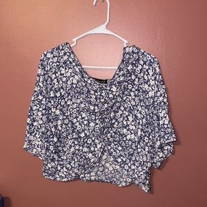 XL cropped, crossed front short sleeve shirt. Light navy with floral print.